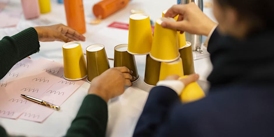 Students stacking cups